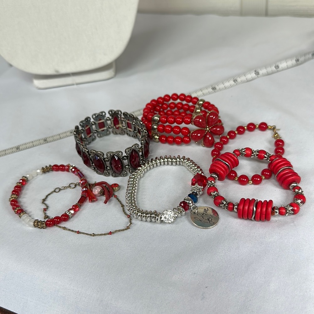 Group of seven red vibe bracelets